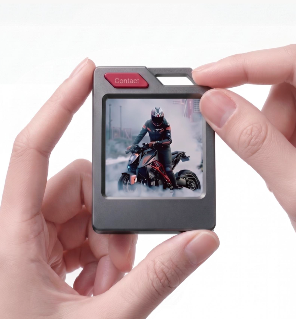 PhotoTag held in hands with a personal E-Ink photo